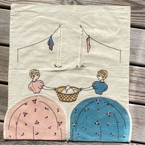 Decorate a bare laundry room wall with a vintage laundry bag!